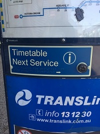a photo of A close up image of a bus timetable announcer button, including accessible signage
