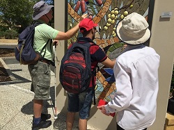 Peter & Kushal exploring a tactile mural