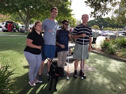 Group at Labrador, Hailey, Jack, Kushal and Peter standing next to each other in a park setting